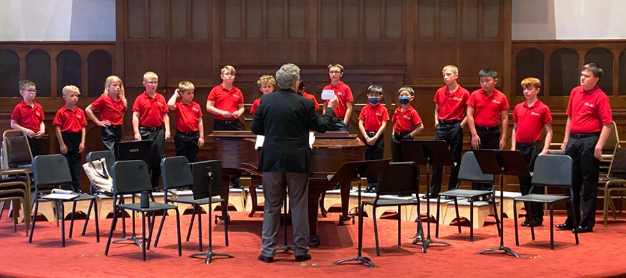 La Crosse Boychoir singing at a formal rehearsal in the Capella Performing Arts Center in Wisconsin.