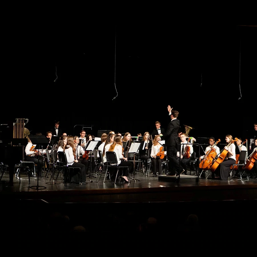 La Crosse Youth Symphony Orchestra formal rehearsal on stage.